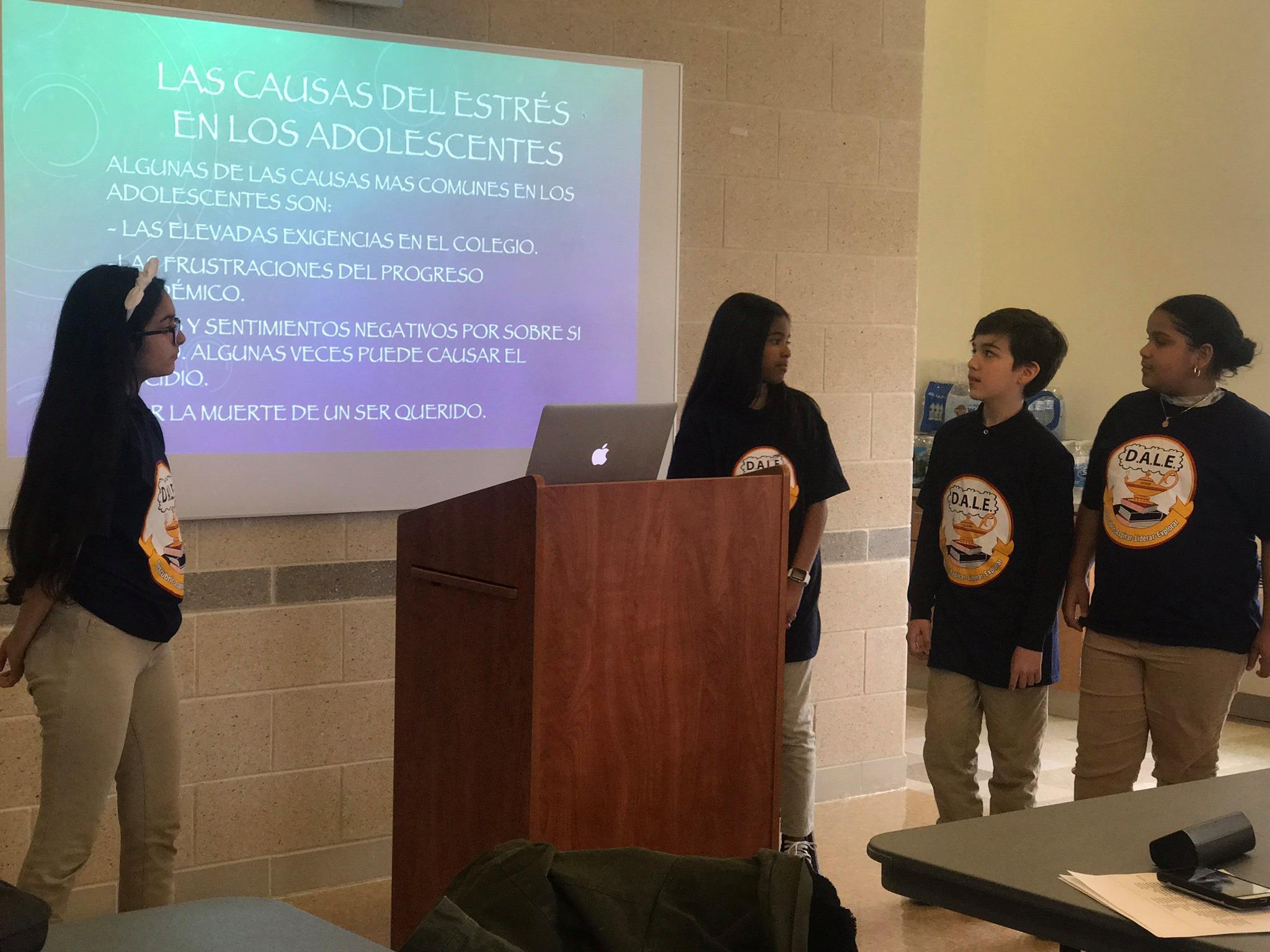four kids wearing DALE T-shirt presenting a adolescents and stress presentations