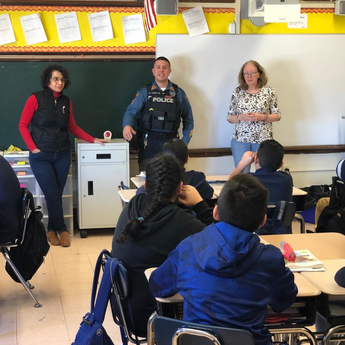 Mrs. Del Gaudio, Officer Vasquez, & Principal O'Connell talking to room 302 students