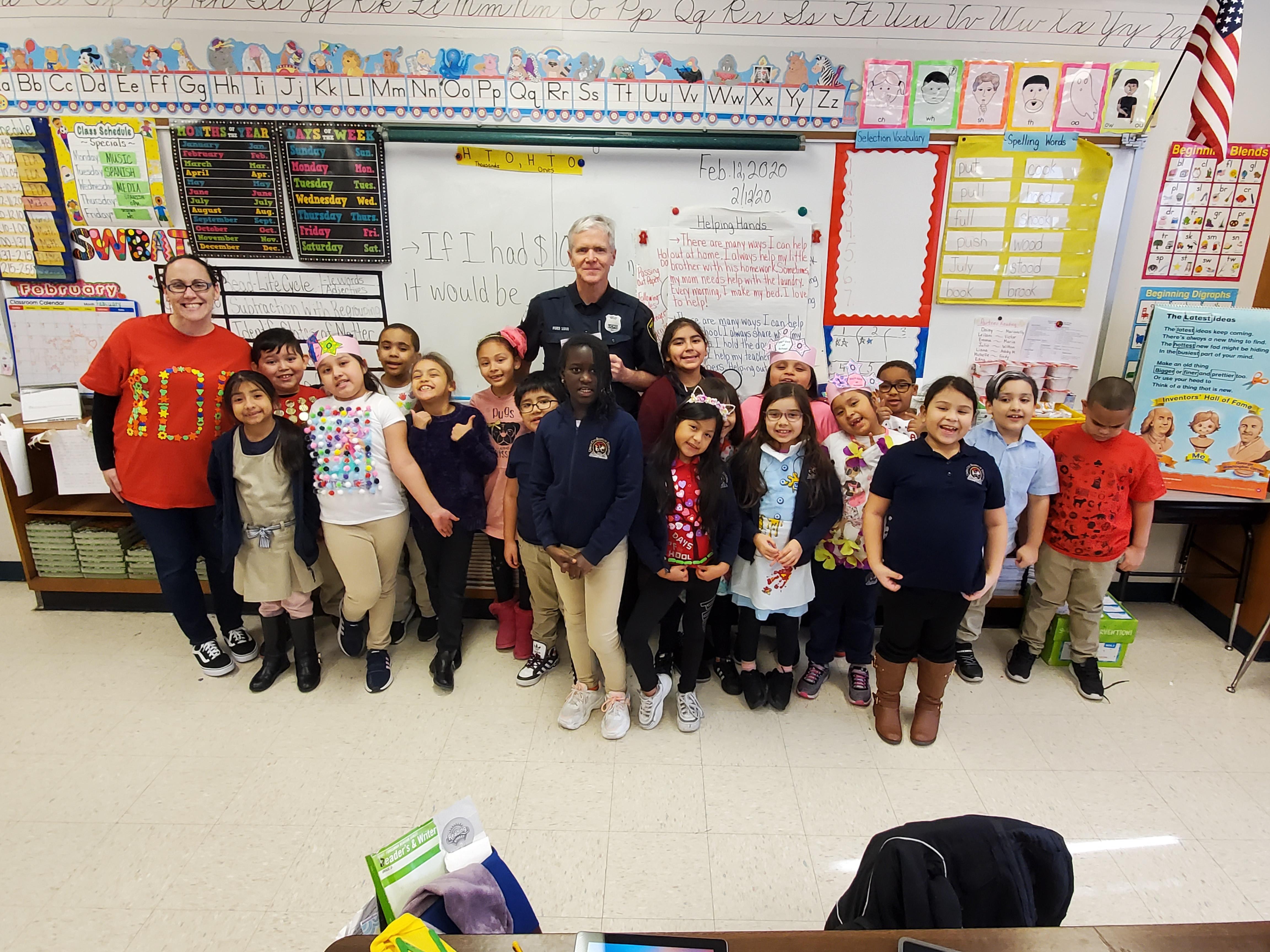 Room 605 students with teacher and Officer Ford