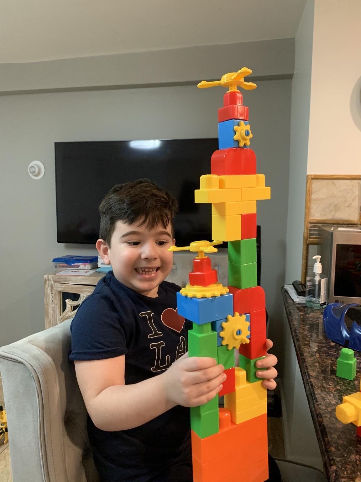 boy with lego structure